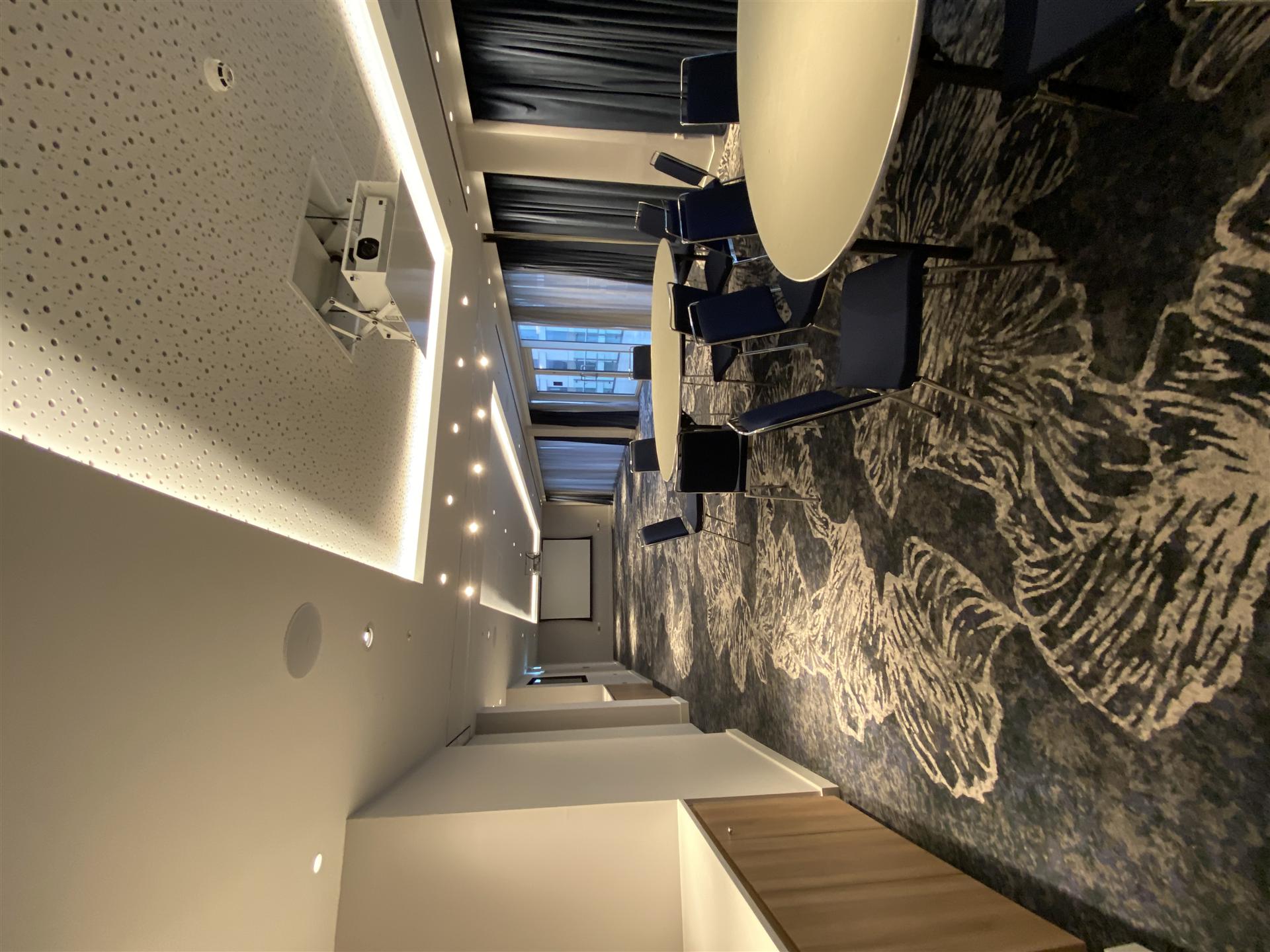 Conference room with perforated LED ceiling and feature wallpaper, Essex